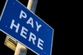 Car Park Pay Here Sign on a Pole Royalty Free Stock Photo