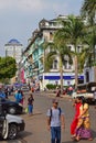 Car parked and colourful shophouses along Sule Pagoda Road in Yangon, Myanmar Royalty Free Stock Photo