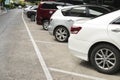 Car parked neatly inside an outdoor parking lot