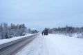 The car is parked on the side of a winter road. Arctic snow straight winter road Royalty Free Stock Photo