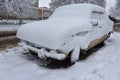 Car parked in the yard covered with snow Royalty Free Stock Photo