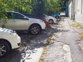 Car Parking on the broken sidewalk in Chisinau.