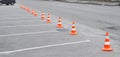 Car parking lot and orange traffic cone. Closed car parking lot with white mark and traffic cone on street used warning sign on Royalty Free Stock Photo