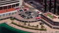 Car parking lot at waterfront viewed from above all day timelapse, Aerial view. Royalty Free Stock Photo