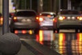 Car Parking place, emergency lights. Night cars. City life in evening, rain. Abstract defocused background