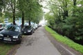 Car parking on roadside in San Donato Milanese, Milan, Italy.