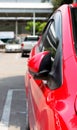 Car parking with side rear-view mirror closed for safety Royalty Free Stock Photo