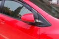 Car parking with side rear-view mirror closed for safety Royalty Free Stock Photo