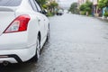 Car parking on the street of village while raining and show leve Royalty Free Stock Photo