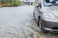 Car parking on the street of village while raining and show leve Royalty Free Stock Photo