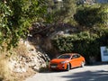 Car parks on a mountain road near a residential building. South of Turkey.