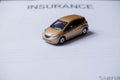 Car placed on insurance documents. Car insurance concept