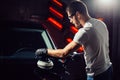 Car polish wax. worker hands holding a polisher Royalty Free Stock Photo