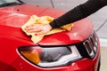 Car polishing with yellow microfiber cloth. Protection of paintwork