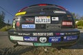 Car with political and social issues bumper stickers in Oak View, California