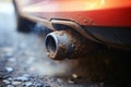 Car pollution captured Close up of an old vehicles exhaust pipe