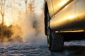 Car and powerful exhaust fumes in the air in Finland. Royalty Free Stock Photo