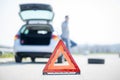 Car problems, red warning triangle! Royalty Free Stock Photo