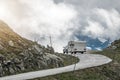 Car Pulling Travel Trailer on the Scenic Alpine Road Royalty Free Stock Photo