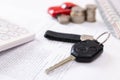 Car purchase concept. Car keys, calculator, toy car, coins and purchase contract Royalty Free Stock Photo