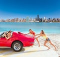 Car pushing teen girls humor funny guy driving Royalty Free Stock Photo