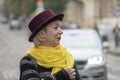 A car is racing towards the elderly woman from behind. Perhaps she was distracted when crossing the road, the inevitability of an Royalty Free Stock Photo