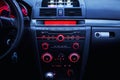 Car radio and air conditioner system. Button on dashboard in modern car panel. Royalty Free Stock Photo