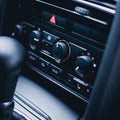 Button on dashboard in modern car panel. Royalty Free Stock Photo