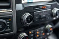 Car radio front volume closeup. Car radio controls. Modern car audio system. Interior Of Luxury Car. Royalty Free Stock Photo