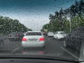 in the car, raindrops run down the windshield and the wipers work Royalty Free Stock Photo