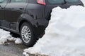 Car rear detail locked by snow heap