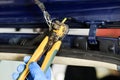 . car. rear trunk lid. wire damage. they are naked very dangerous. electrician eliminates damage with the help of special tools Royalty Free Stock Photo