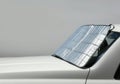 Car with reflective sunshade on front windshield Royalty Free Stock Photo