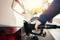 Car refueling on petrol station. Man pumping gasoline oil. This