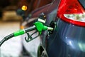 Car refueling on a petrol station in winter at night Royalty Free Stock Photo