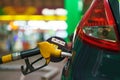 Car refueling on a petrol station in winter at night Royalty Free Stock Photo