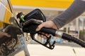 Car refuelling on the petrol station. Man refilling the car with fuel. Close up view. Gasoline, diesel is getting more Royalty Free Stock Photo