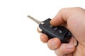 Car remote control key in hand with white background Royalty Free Stock Photo