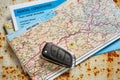 Car remote key, map and rental agreement Royalty Free Stock Photo