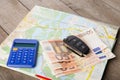 Car rental concept - car key,calc, and money on the map Royalty Free Stock Photo