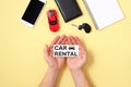 Car rental concept. Human hands holding text sign Royalty Free Stock Photo