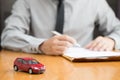Car rental inspector filling contract,