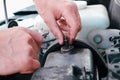 Car repair. Auto mechanic working on car engine in mechanics garage. Repair service. close-up shot Royalty Free Stock Photo