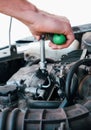 Car repair. Auto mechanic working on car engine in mechanics garage. Repair service. close-up shot Royalty Free Stock Photo