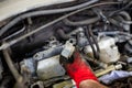 Car repair. Installing a conductor on a spark plug Royalty Free Stock Photo