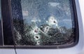 Car riddled with bullets. War of Russia against Ukraine. A car of civilians shot by the Russian military during the evacuation of Royalty Free Stock Photo