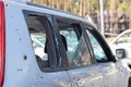 Car riddled with bullets. War of Russia against Ukraine. A car of civilians shot by the Russian military during the evacuation of Royalty Free Stock Photo