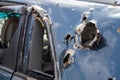 Car riddled with bullets. War of Russia against Ukraine. A car of civilians shot by the Russian military during the evacuation of Royalty Free Stock Photo