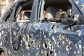 Car riddled with bullets. War of Russia against Ukraine. A car of civilians shot by the Russian military during the evacuation of Royalty Free Stock Photo