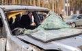 Car riddled with bullets. War of Russia against Ukraine. A car of civilians shot by the Russian military during the evacuation of Royalty Free Stock Photo